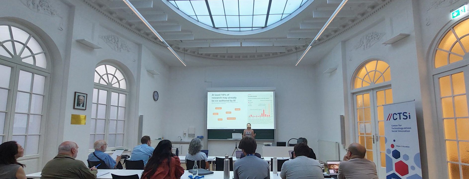 View into the lecture hall during a paper presentation on AI co-authorship in research